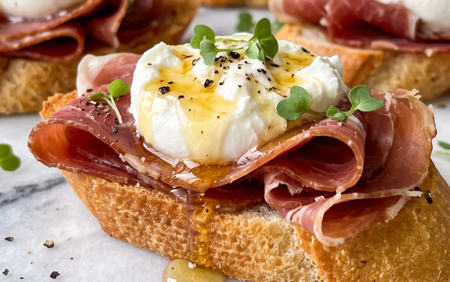 Beef Prosciutto Crostini with Burrata and Lemon Honey Drizzle